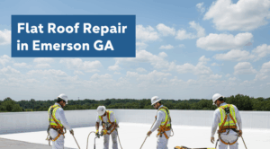 Four roofers in white uniforms, hard hats, and safety harnesses are performing flat roof repair on a commercial building under a blue sky with scattered clouds. They are working on a section of the white roof, applying sealant or new material. A yellow toolbox is on the roof nearby.